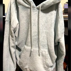 White fur hoodie with strings that can adjust the hood.